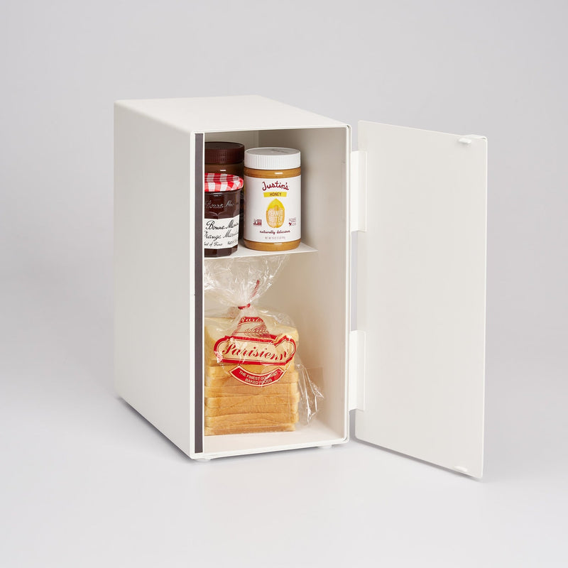 Yamazaki Home Bread Box shown open with jars of Bonne Maman marmalade, Justin’s Honey Peanut Butter, and Parisienne sliced bread, showcasing its storage capability.