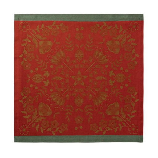 Le Jacquard Francais | Féerie Napkin features a reddish-orange floral motif with a green border, adding festive charm to holiday table settings.