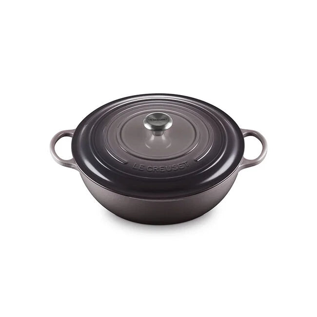 Le Creuset | Signature Chef's Oven, a round enameled cast-iron braiser with dual handles and a stainless-steel knob, ideal for versatile cooking tasks.