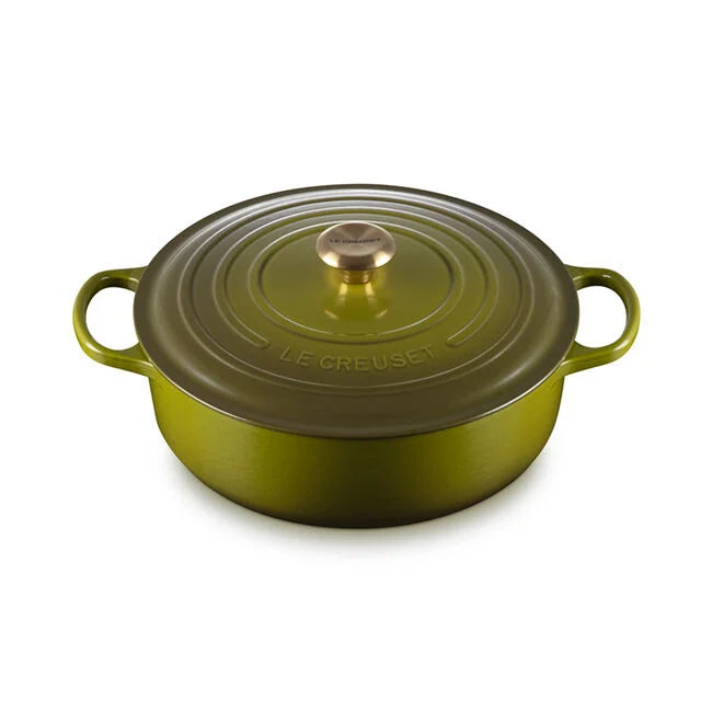 Le Creuset | Signature Round Wide Oven - Olive: A green enameled cast-iron braiser with side handles, perfect for versatile cooking from stove to table.
