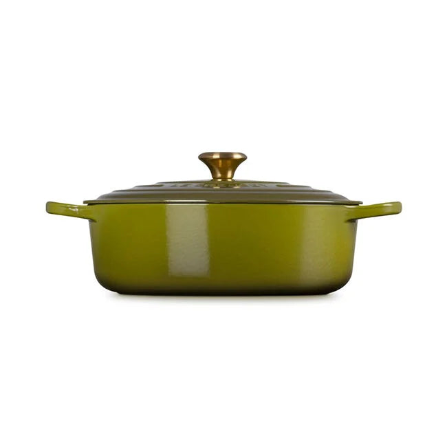 Le Creuset | Signature Round Wide Oven - Olive: Enameled cast-iron casserole with side handles and brass knob, ideal for versatile cooking, serving, and batch meal preparation.