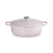 Le Creuset | Signature Round Wide Oven - Shallot, an oval enameled cast-iron Dutch oven with lid and side handles, ideal for versatile cooking and easy serving.