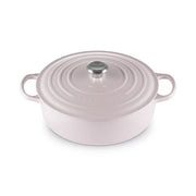 Le Creuset | Signature Round Wide Oven - Shallot, a pastel pink enameled cast-iron Dutch oven with side handles and a fitted lid, ideal for versatile cooking.