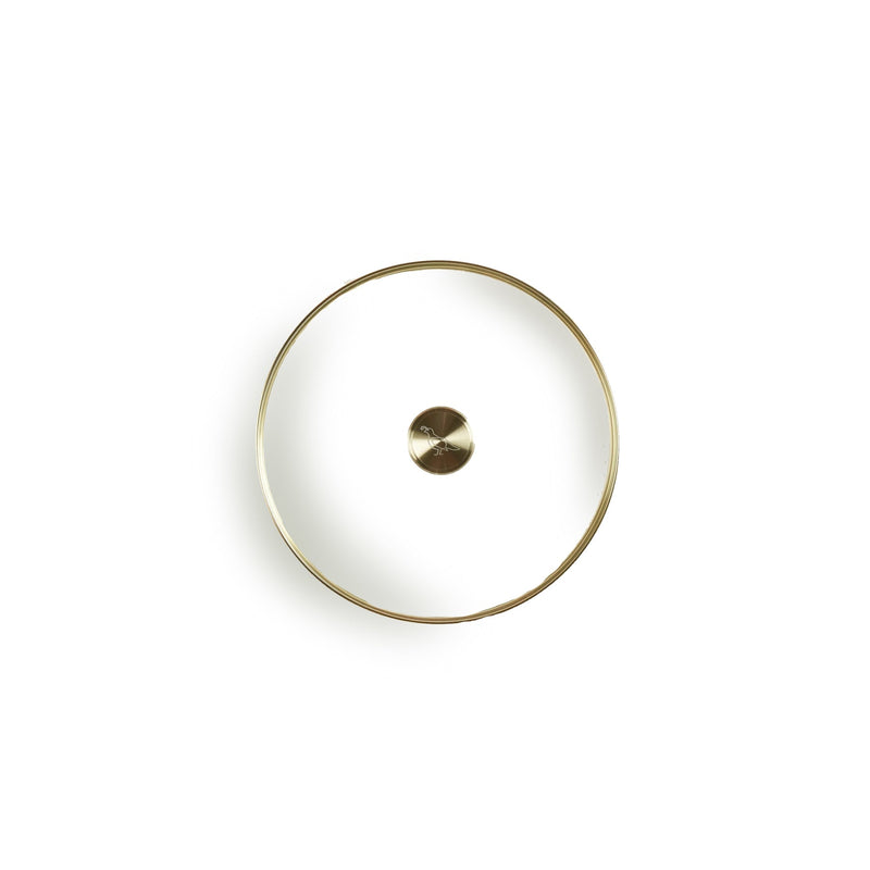 Smithey | Glass Lids: Circular metal coin-like pendant, resembling a stylish fashion accessory, featured as part of Athens Cooks' curated kitchen collection.