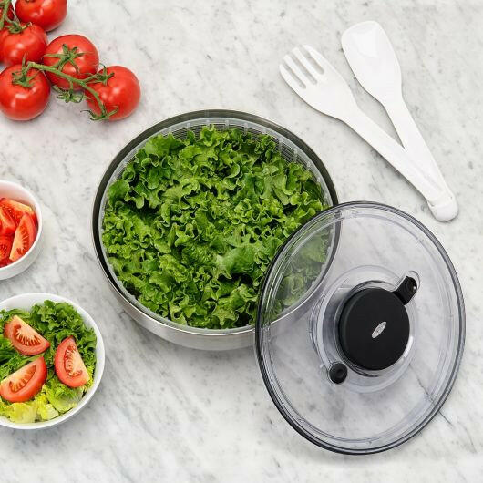 OXO Good Grips Salad and Herb Spinner with stainless steel bowl, featuring a non-slip knob and base, doubles as a colander for efficient drying and serving.