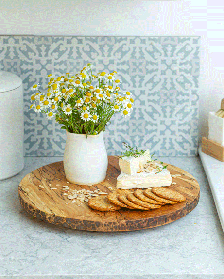 Peterman's Boards and Bowls 20 Lazy Susan - Spalted displayed with a plate of cheese and crackers, emphasizing its smooth, durable rotating feature for kitchen convenience.