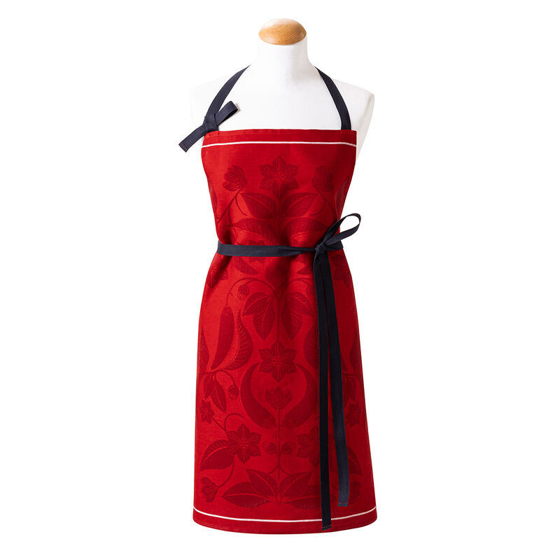 Le Jacquard Francais | PIMENTS APRON featuring red fabric and contrasting black straps, ideal for culinary enthusiasts seeking stylish kitchen wear.