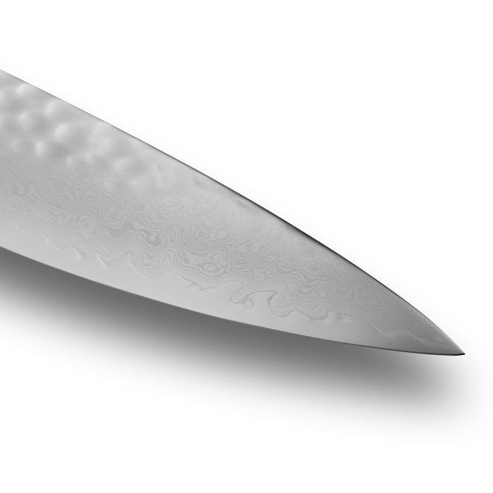 Shun | Premier Carving Set, 2 Blonde: Close-up of a Damascus-finished knife blade with hammered texture, showcasing elegant craftsmanship for precise slicing in culinary settings.