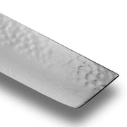 Close-up of Shun Premier Nakiri Walnut 5.5 knife blade, showcasing Damascus pattern and tsuchime dimples, ideal for precise vegetable slicing in any kitchen.