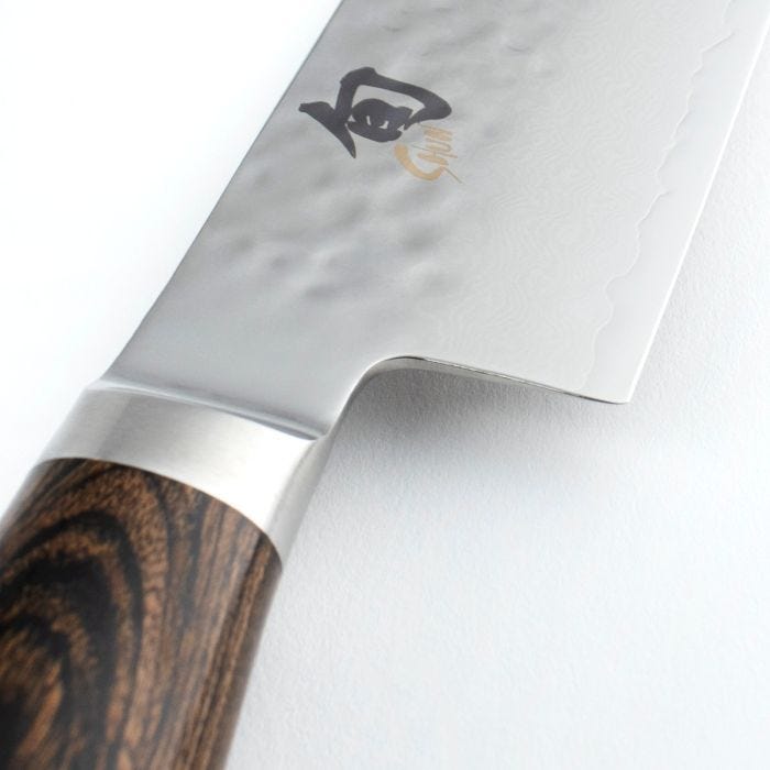 Shun Premier Kiritsuke Walnut, 8 knife with a hammered finish, wooden handle, and stylized character near the spine, ideal for versatile culinary tasks.