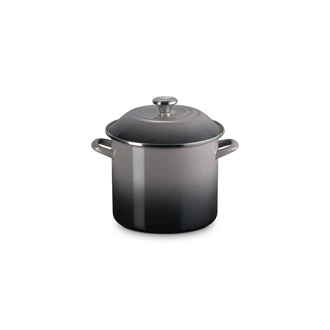 Le Creuset stockpot with gradient gray enamel, tall sides, and side handles, featuring a matching lid with a central knob, ideal for large-batch cooking.