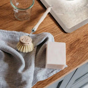 Andrée Jardin | Dish Brush Replacement Head on a table, showcasing its genuine beech wood construction and stiff vegetal fibers designed for effective, scratch-free cleaning.