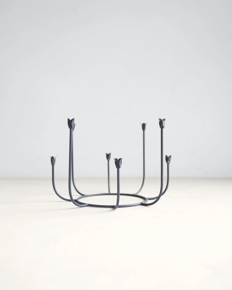 The Floral Society | Beacon Long Stem Candelabra, a wrought iron piece with curved stems and tulip candle cups for eight tapers, inspired by garden gates.