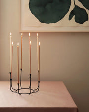 The Floral Society | Beacon Long Stem Candelabra, featuring elegant curved stems and tulip candle cups, designed to hold eight tapers, showcased in a kitchen setting.