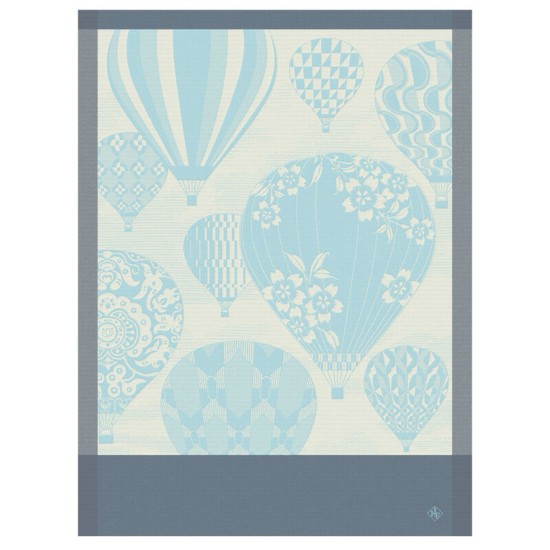 Le Jacquard Français | Cappadoce Tea Towel, Blue, featuring elegant hot-air balloons with decorative patterns, framed in slate-gray, perfect for enhancing any kitchen setting.