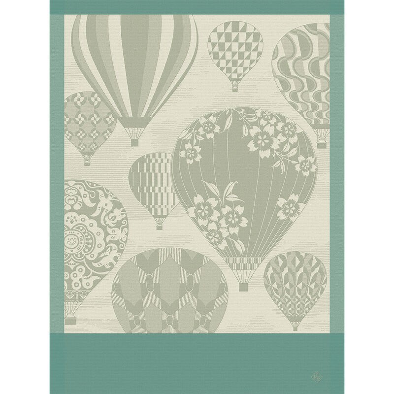 Le Jacquard Francais | Cappadoce Green Tea Towel features stylized hot-air balloons, floral and geometric patterns, and teal borders, capturing Cappadocia's charm in a woven design.