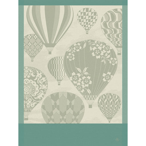 Le Jacquard Francais | Cappadoce Green Tea Towel features stylized hot-air balloons, floral and geometric patterns, and teal borders, capturing Cappadocia's charm in a woven design.