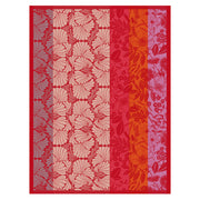 Le Jacquard Français | Cottage Tea Towel featuring stylized floral motifs in red, orange, and pink tones, enhancing your kitchen's decor with vibrant elegance.