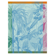 Le Jacquard Français | Equateur Tea Towel, Blue: Features a tropical jungle scene with palm trees, passionflowers, and a parrot, perfect for vibrant kitchen decor.
