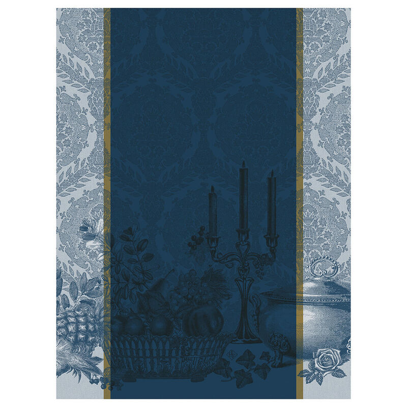 Le Jacquard Français Festin Tea Towel featuring a navy and sky-blue still life with a candelabra, fruit basket, tureen, and damask border.