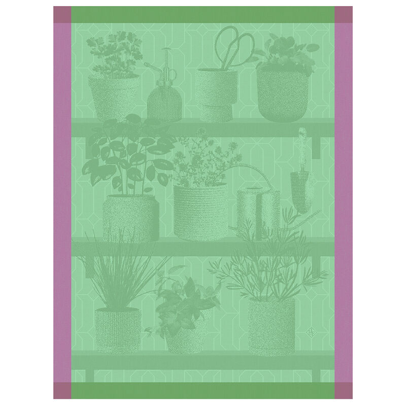 Le Jacquard Français | Herbes Fraiches Tea Towel, Green displayed with potted herbs and gardening tools on wooden shelves, emphasizing culinary and kitchen application.