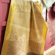 Le Jacquard Français | Vignoble Tea Towel, Yellow: vineyard-patterned towel draped over cabinet, showcasing exquisite Burgundy-inspired Jacquard weaving, ideal for sophisticated kitchen decor.
