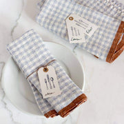 Caravan Home's 20 x 30 Gingham Blue & Cognac Towels with utensil tags, perfect for rustic table settings at Athens Cooks.