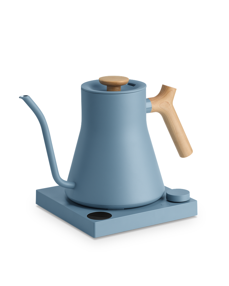 FELLOW | Stagg EKG Pro Electric Kettle, Hazy Blue w/ Maple, featuring a gooseneck spout and electric base for precise pour-over coffee brewing.