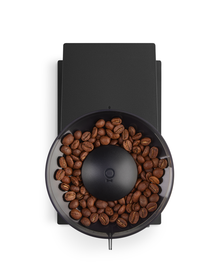 FELLOW | Opus Conical Burr Grinder, Matte Black, top-down view of bean hopper with central grind-setting knob and spout, showcasing versatility for various coffee brewing styles.