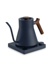 FELLOW | Stagg EKG Pro Electric Kettle, Stone Blue w/ Walnut, featuring a precision spout, wooden accents, and a temperature-controlled base, ideal for pour-over coffee enthusiasts.