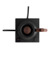Fellow | Stagg EKG Pro Electric Kettle with walnut accents on a black induction base, featuring digital display and control dial for precise brewing.