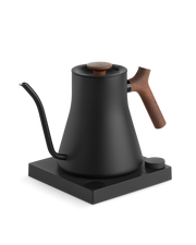 Fellow | Stagg EKG Pro Electric Kettle, Matte Black with Walnut Accents, featuring a gooseneck spout and temperature-control base, ideal for precise pour-over coffee brewing.