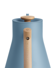 FELLOW | Stagg EKG Pro Electric Kettle, Hazy Blue w/ Maple, showcasing its gooseneck design, natural wood handle, and knob for precise pour-over coffee brewing.