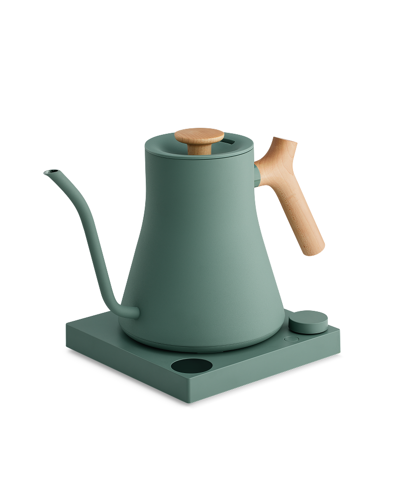 FELLOW | Stagg EKG Pro Electric Kettle in matte green with maple accents, ideal for precision pour-over coffee, featuring variable temperature control on a sleek base.