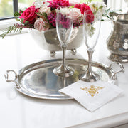 Arte Italica & Crown Linen Designs | Vintage Tray with Handles featuring champagne flutes, a linen napkin, and a floral arrangement, embodying classic Italian pewter craftsmanship.