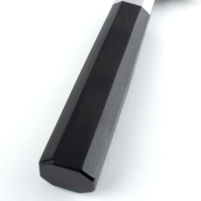Shun Dual Core Kiritsuke, 8-inch knife with octagonal black handle and white ferrule, showcasing traditional Japanese craftsmanship with a high-performance blade.