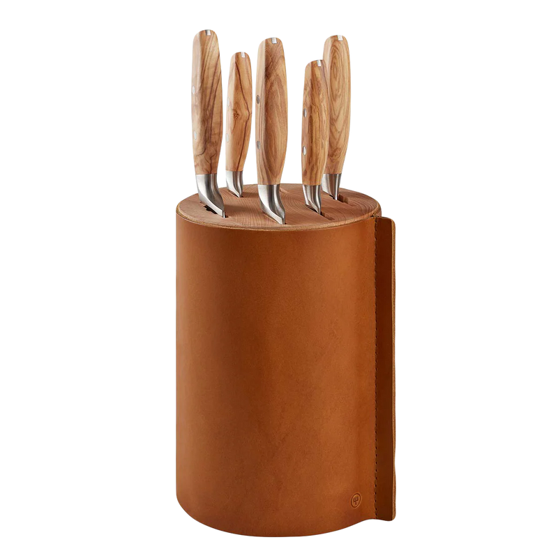 Wusthof | Villa 6-Piece Knife Block Set: Cylindrical, leather-bound block with five knives, featuring light wood-grain handles and stainless-steel blades, designed for stylish, safe storage.