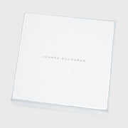 Joanna Buchanan Party Set includes cocktail picks and wine charms, presented in a stylish white box with silver text.