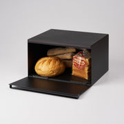 Yamazaki Home | Tower Bread Box, Steel, Black, with a boule, Parisienne sliced bread, and baguette rolls inside, showcasing modern kitchen storage.