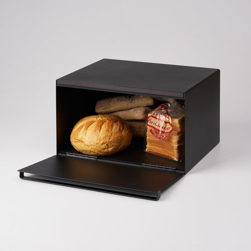 Yamazaki Home | Tower Bread Box, Steel, Black, with a boule, Parisienne sliced bread, and baguette rolls inside, showcasing modern kitchen storage.