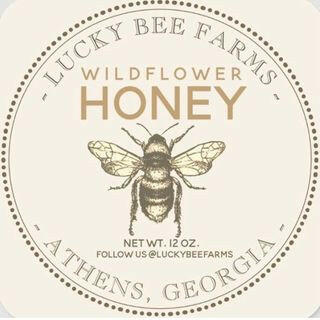 Lucky Bee Farms Honeycomb Jar from Athens, GA, featuring a bee-themed label and coaster, highlighting raw, local wildflower honey's natural sweetness.