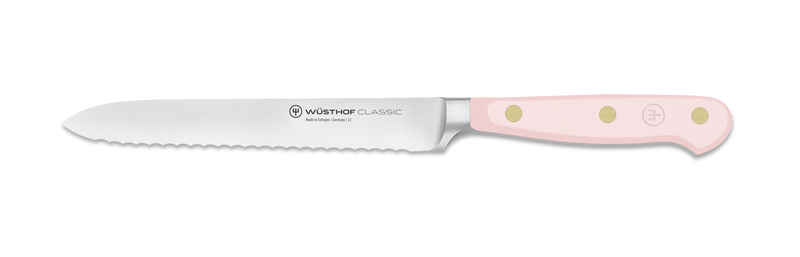 Wüsthof | Classic 5 Serrated Utility - Velvet Oyster, featuring a pink handle and serrated blade, ideal for slicing bread, fruits, and vegetables.