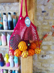 Filt | French Market Bags - Gold, featuring a lemon in a string bag, showcasing the bag's spaciousness and eco-friendly design, ideal for kitchen errands.
