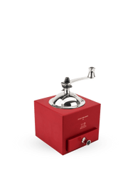 Peugeot | Roellinger Pepper Mill, 5 inches - Red: A traditional hand-crank grinder with a polished metal hopper and handle, featuring a drawer for spice collection.
