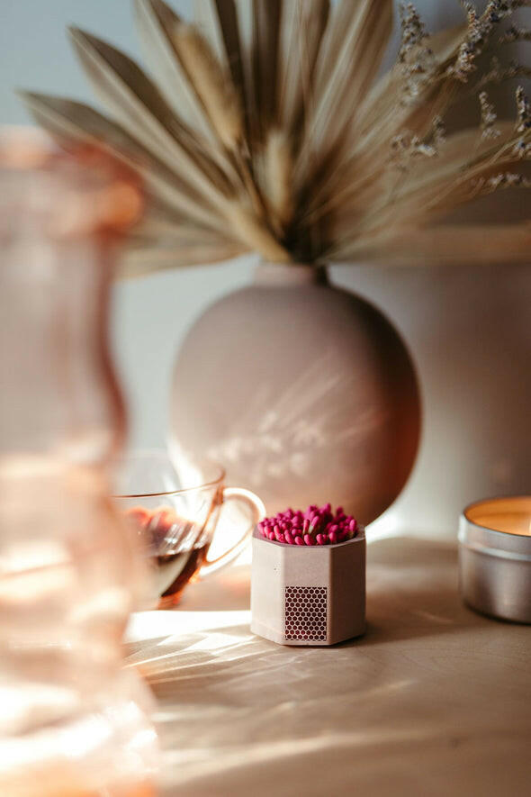 Tenn Prairie Match Holder with Striker and Matches, featuring a hand-poured concrete design with cork bottom, shown close-up on a table.
