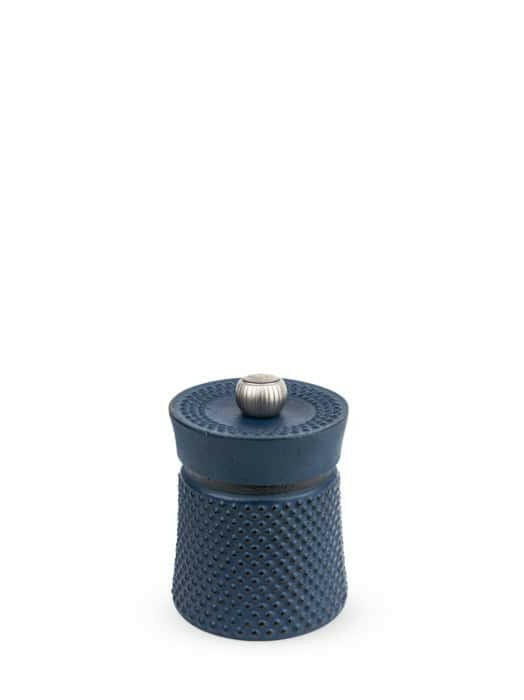 Peugeot | Bali Cast Iron Pepper Mill, 3 Inches - Red, featuring a dimpled texture, matching lid, and metal knob for enhancing dishes with aromatic Sichuan pepper.