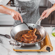 de Buyer | Mineral B PRO Carbon Steel Fry Pan - 12 with handles, ideal for high-temperature cooking, featuring natural non-stick properties, perfect for searing, grilling, and frying.