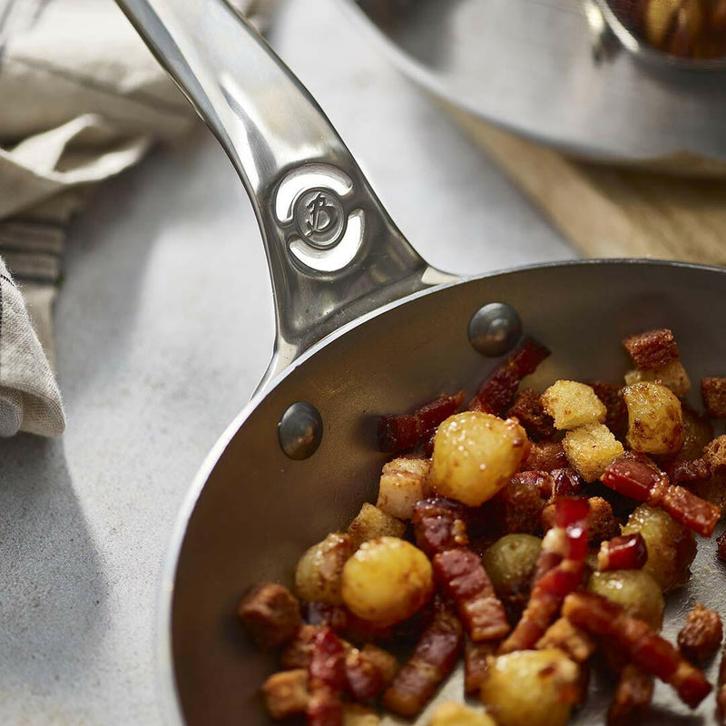 de Buyer | Mineral B PRO Carbon Steel Fry Pan - 12 with handles, ideal for high-temperature cooking and searing. Made in France, perfect for culinary enthusiasts.