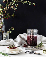 Le Parfait | Super Jars - 1L (32oz) filled with berry jam, accompanied by cheese, herbs, and a spoon, highlighting its elegant, versatile French design for preserving.