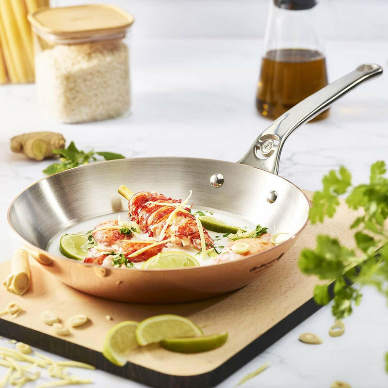 de Buyer | Mineral B PRO Carbon Steel Fry Pan - 12 with handles, ideal for high-temperature cooking, showcasing its durable, naturally non-stick carbon steel construction.